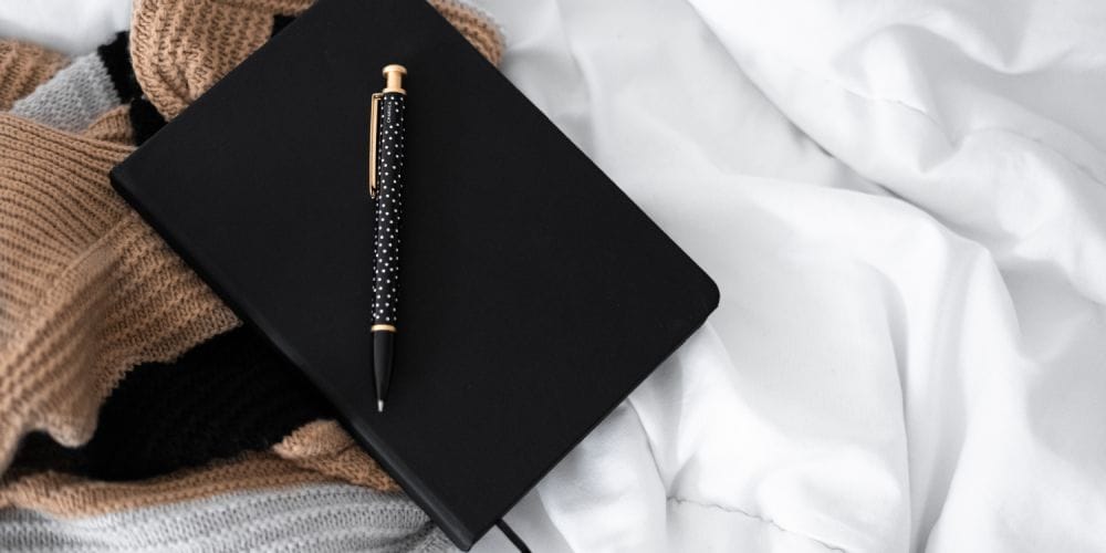 a notebook with journal techniques