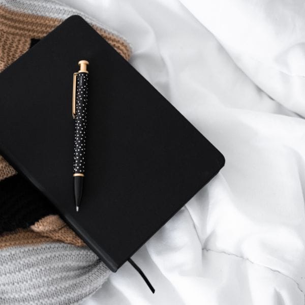 a notebook with journal techniques
