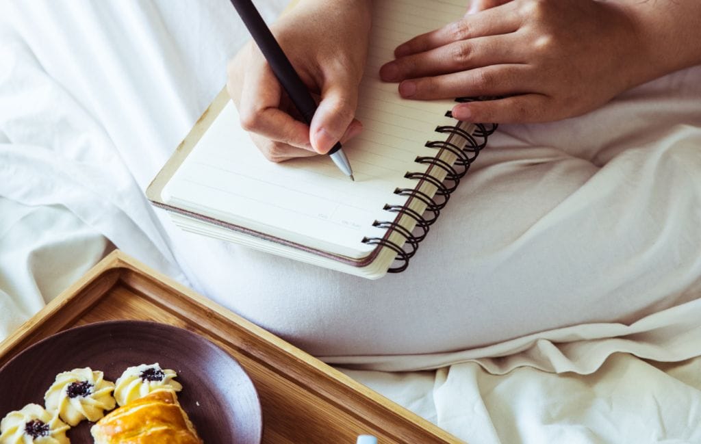 a woman looking for journal inspiration