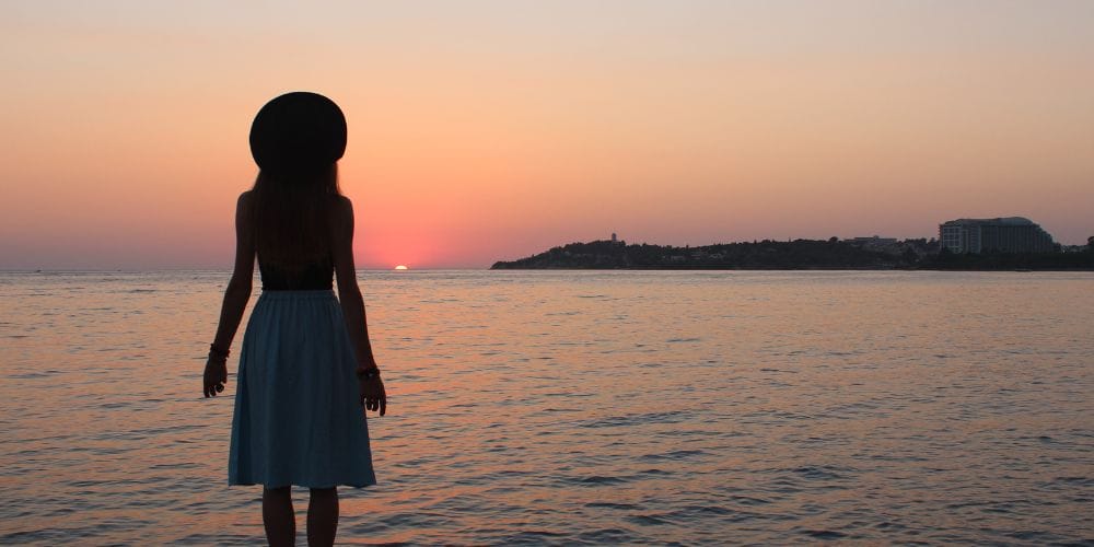 Woman looking at sunrise