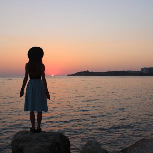 Woman looking at sunrise